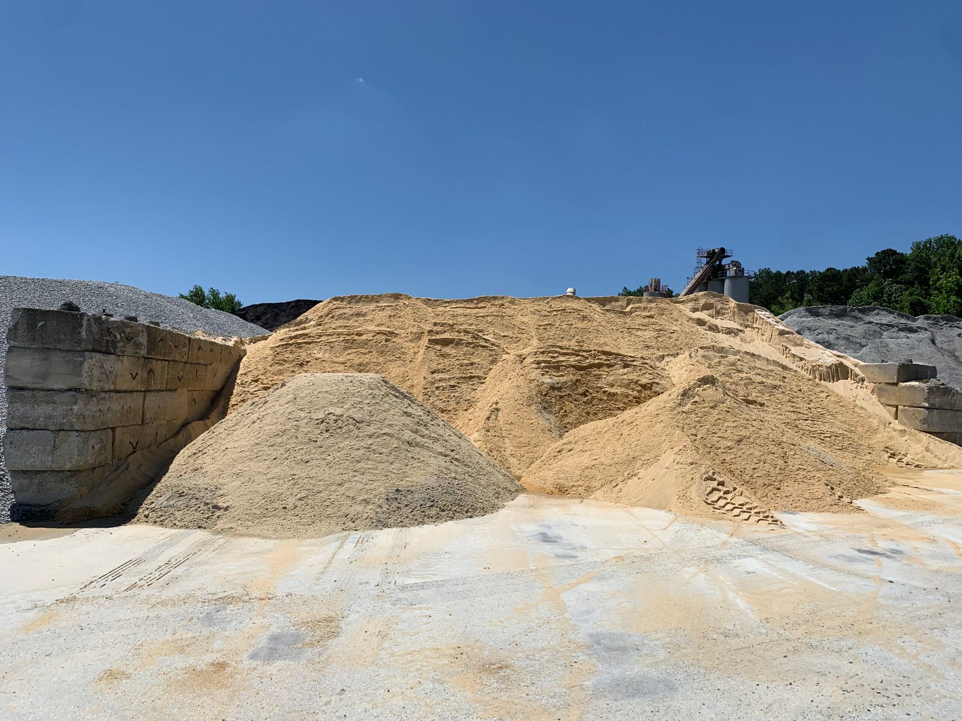 A pile of dirt is sitting on top of a white surface
