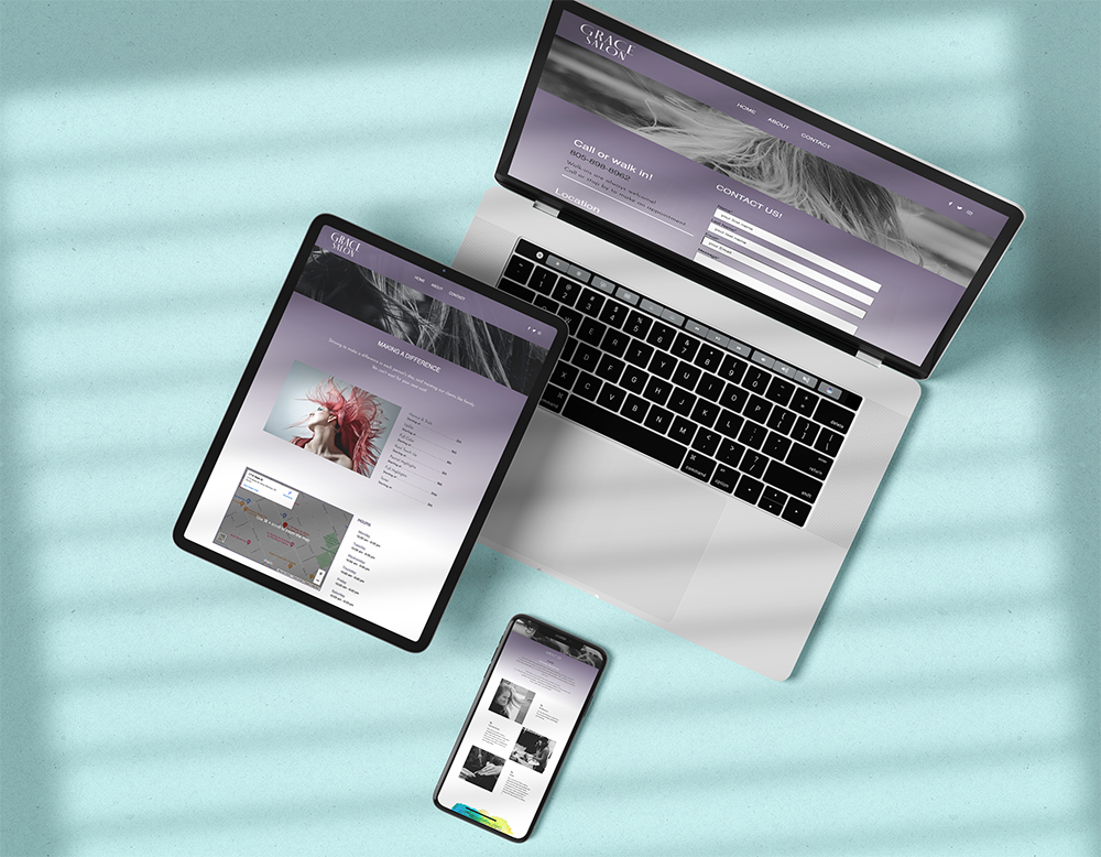 Devices (laptop, tablet, phone) displaying a website on a light blue surface.