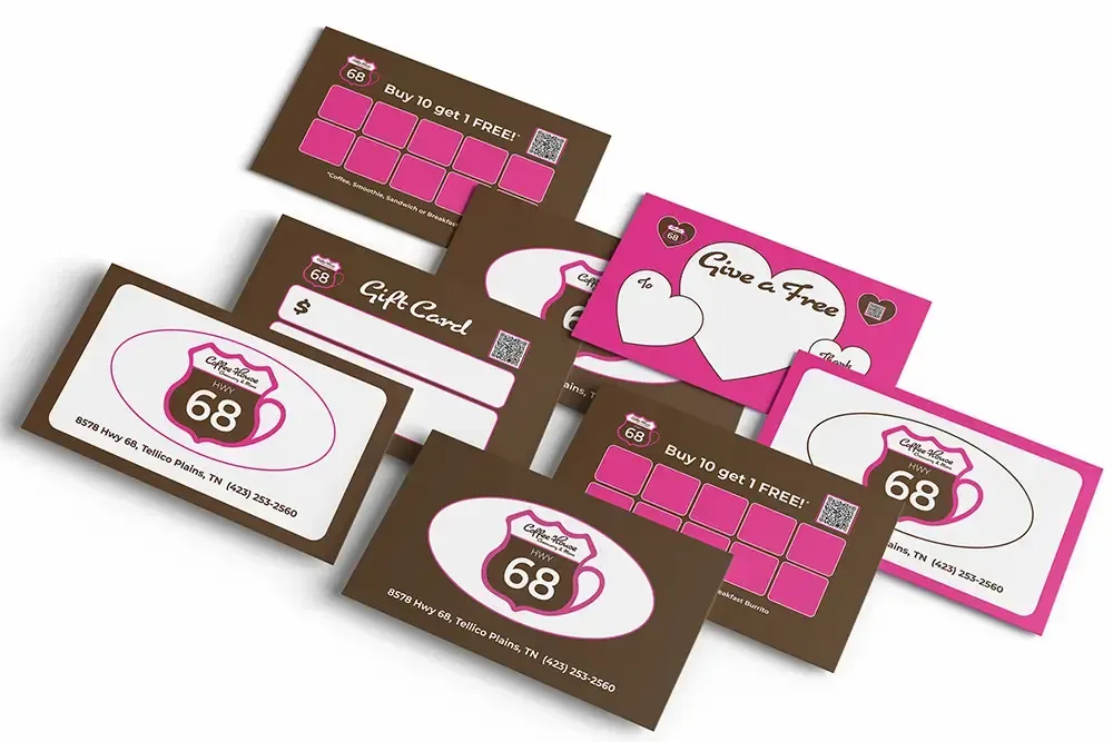 Gift cards and coupons from Cafe 68; various colors, some with hearts.
