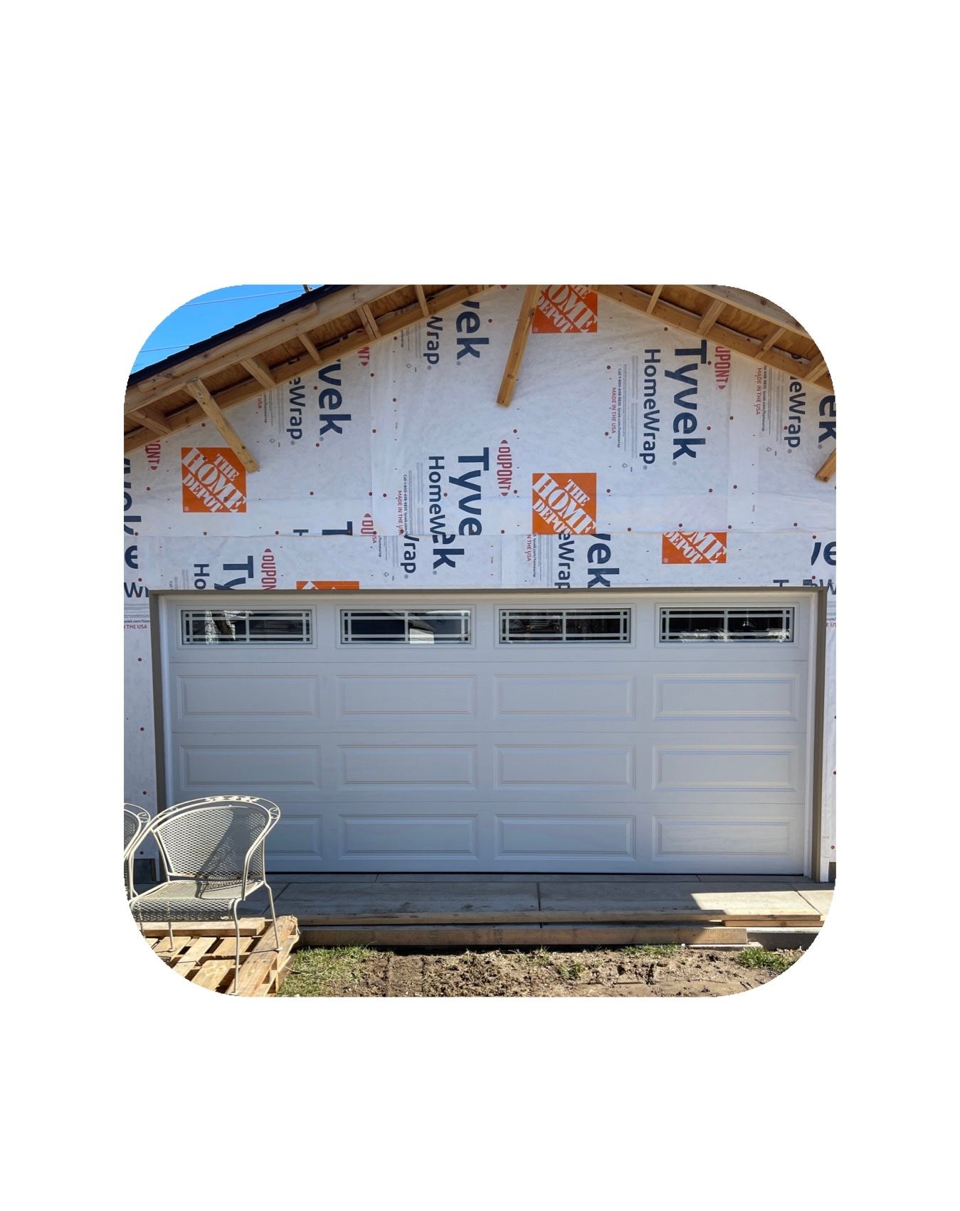 White garage door in a house under construction.