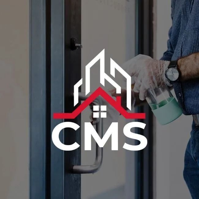 Logo of CMS with a house icon, superimposed on a person sanitizing a door handle with gloves and a spray bottle.
