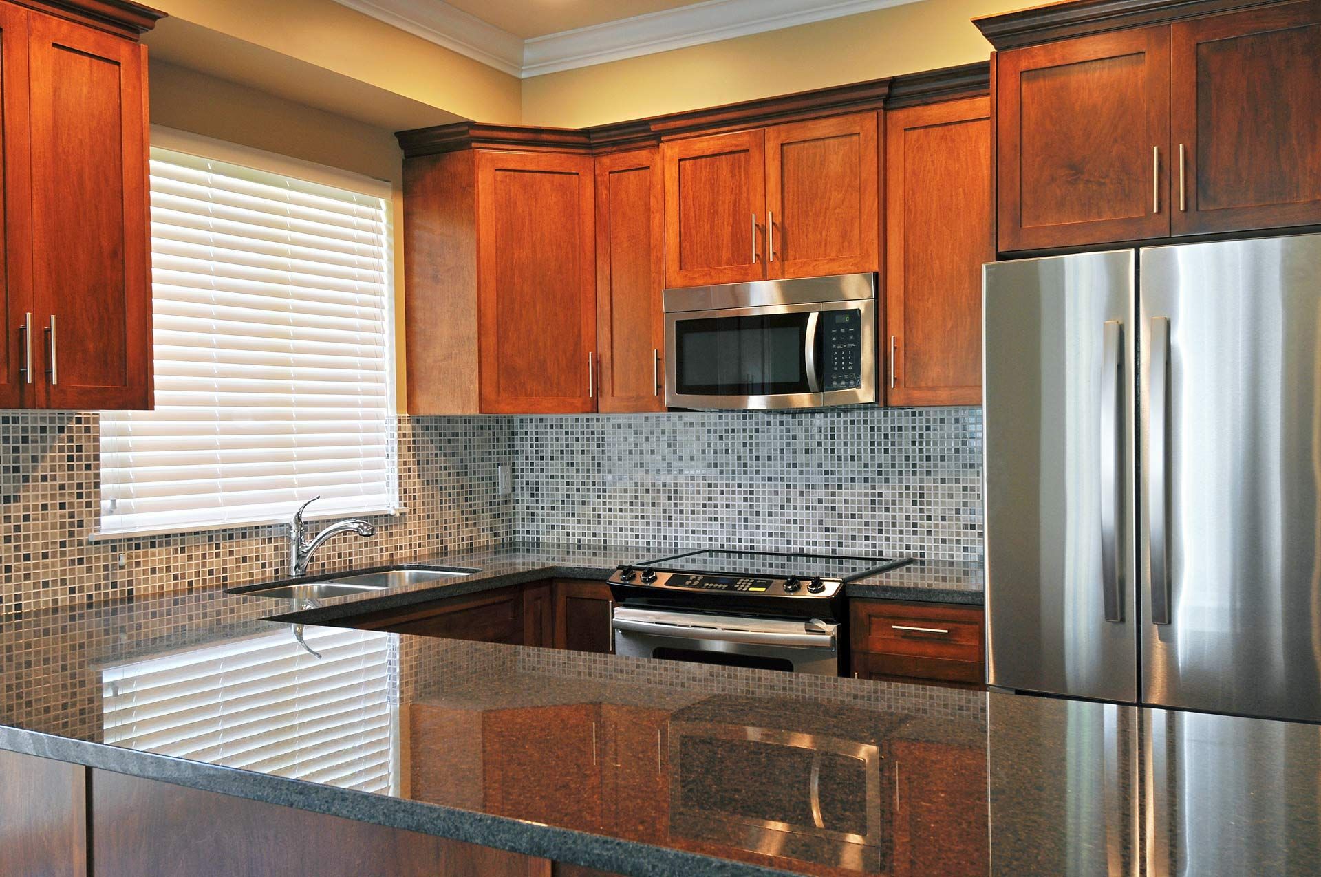 Modern kitchen with shiny granite countertops. Modern kitchen with shiny granite countertops.