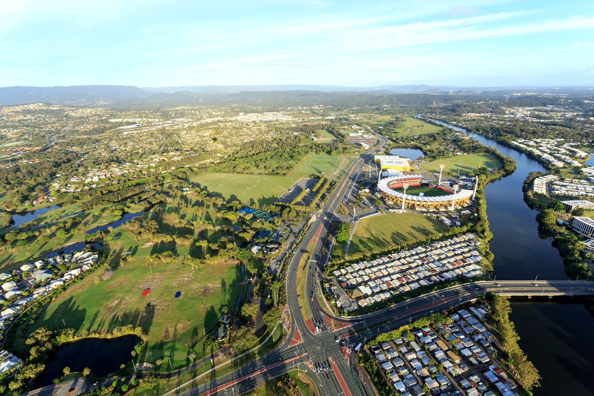 An Aerial View of a City With Tall Buildings and a Beach — NDR Trade Solutions  in Carrara, QLD