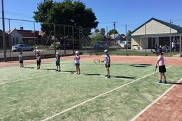 kids in tennis court