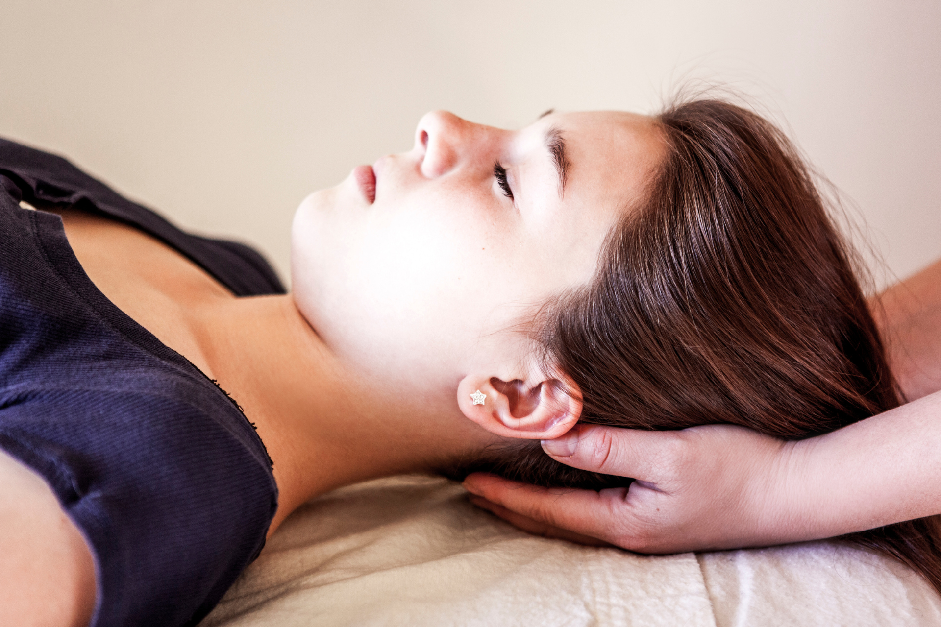 woman receiving a Reiki treatment