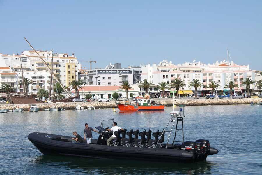 A large boat is floating on top of a body of water.
