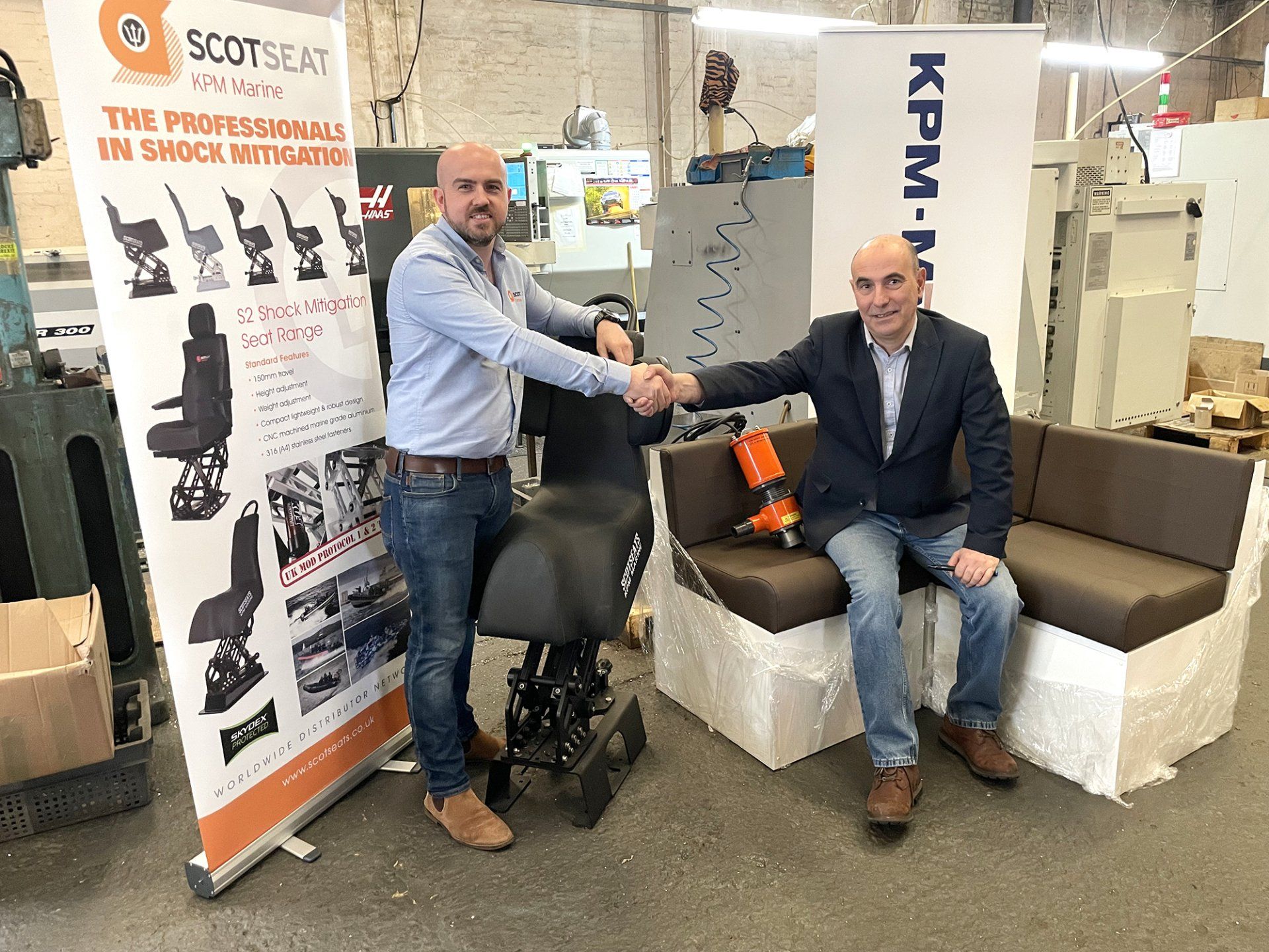 (L-R) Jonathan Young beside S2J Jockey Seat and Julian Morgan with Predator Bilge Pump at KPM Marine