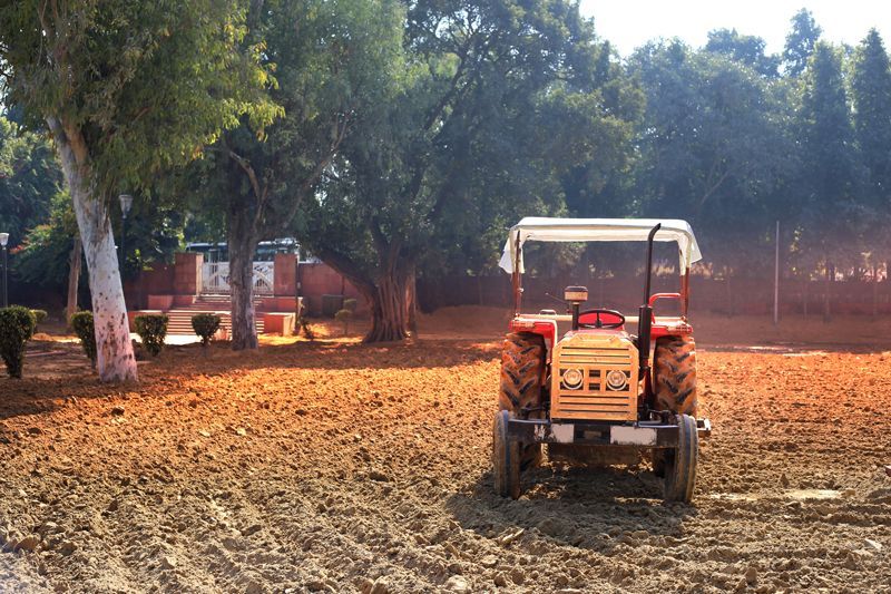 A Diesel Tractor In The Residential Field - Aberdeen, MS - Ground Pounders