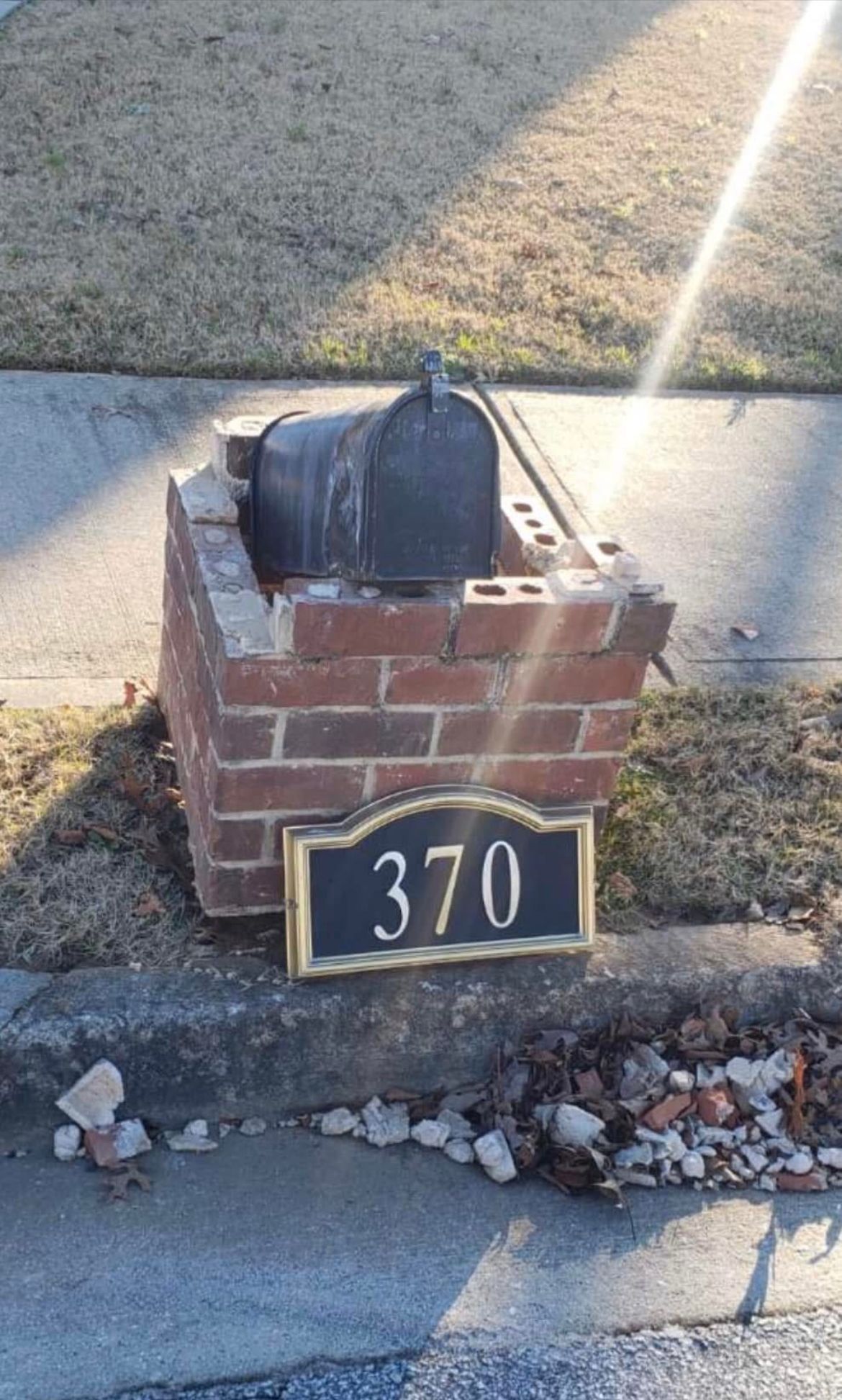 damaged brick mailbox