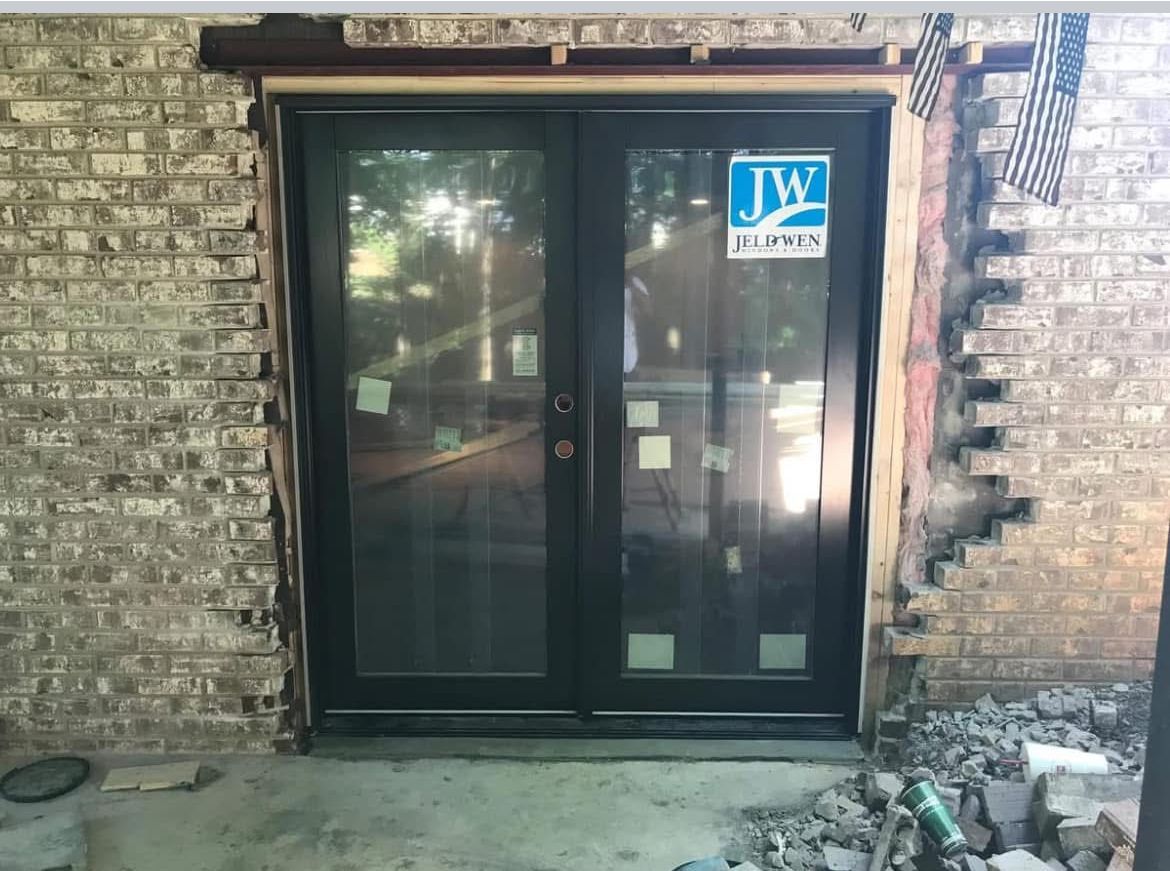 door installation in brick wall