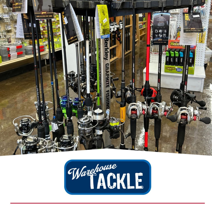 Fishing rods displayed in a Warehouse Tackle store aisle, with reels and price tags visible