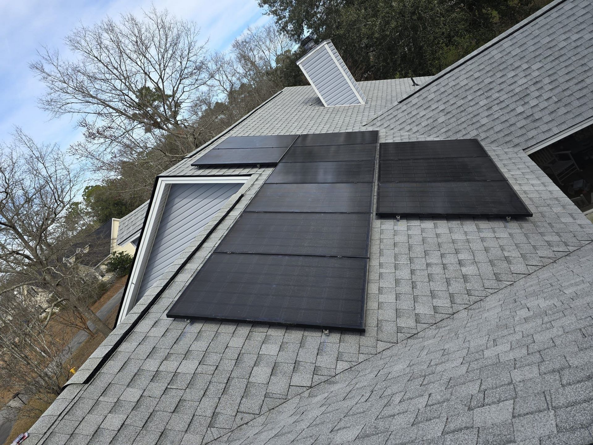 a house with solar panels on the roof — Savannah, GA — 1 Construction Kings LLC