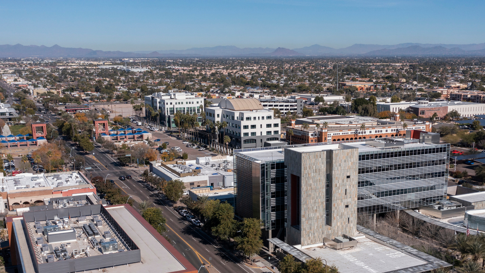 An aerial view of a city with a lot of buildings and trees.