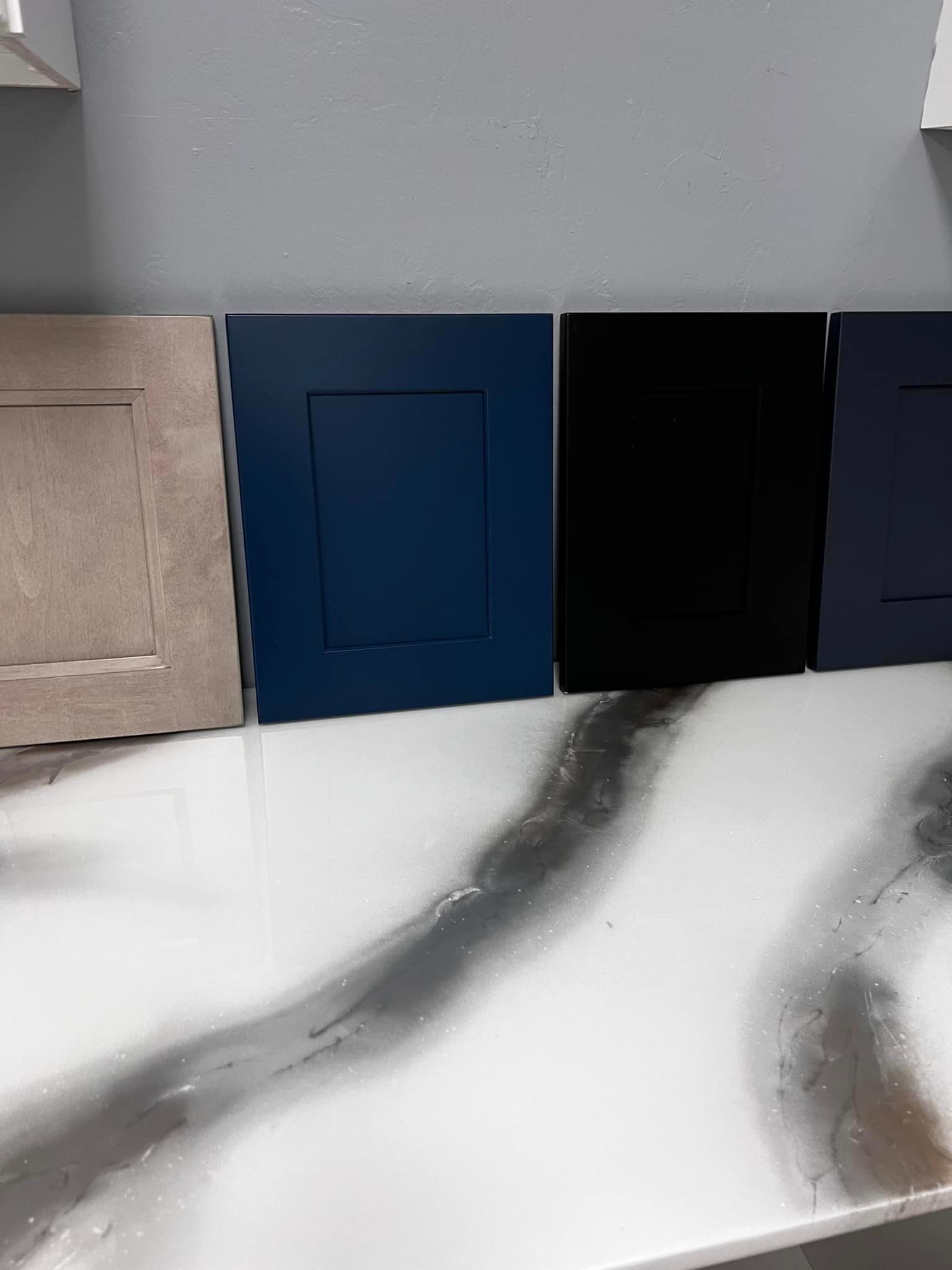 A row of cabinet doors sitting on top of a counter.