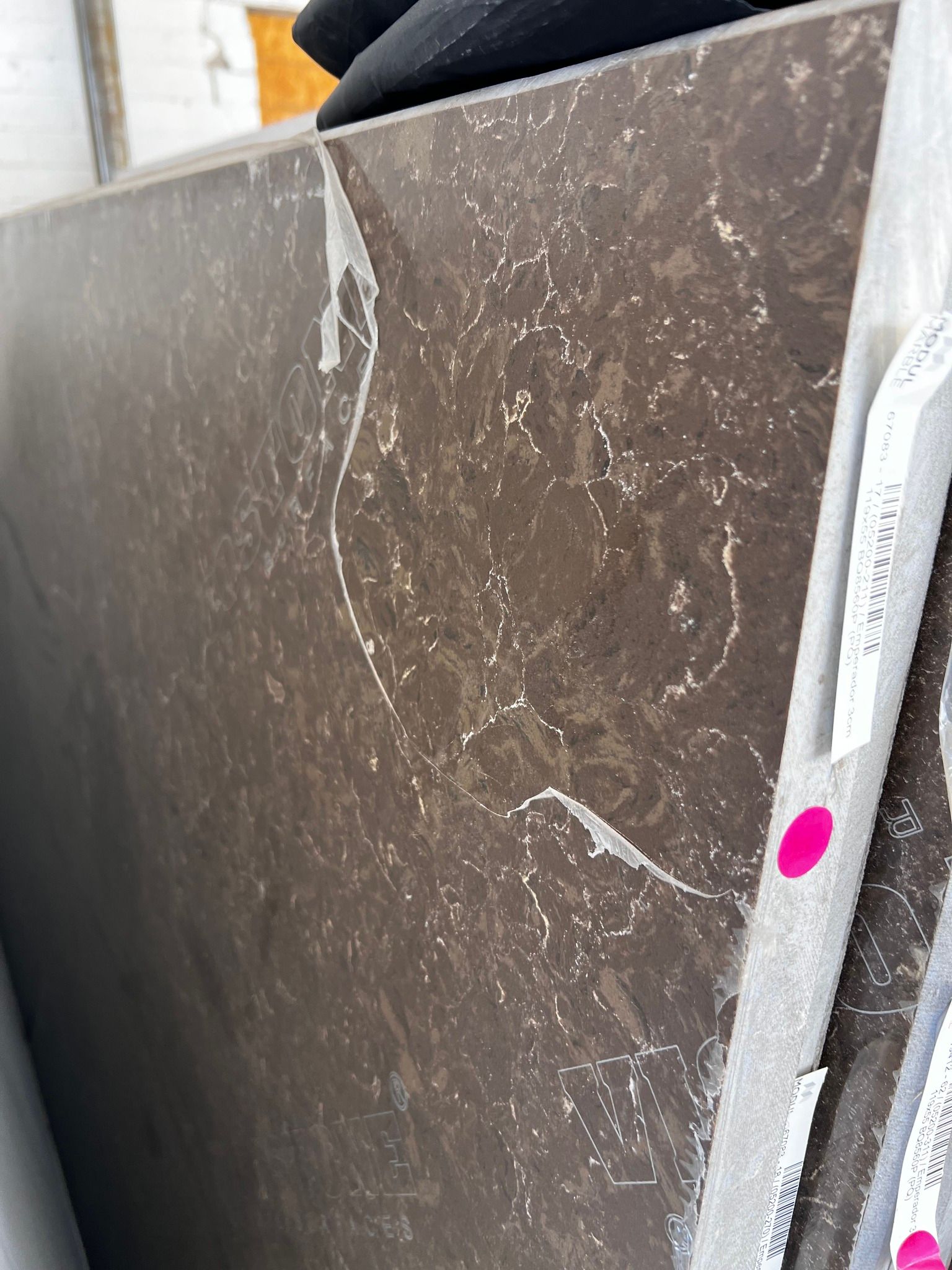 A close up of a piece of marble with a pink circle on it.