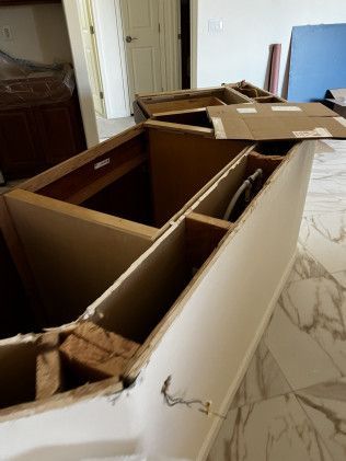 A bunch of cabinets are sitting on top of each other in a room.