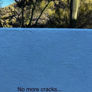A white wall with the words `` no more cracks '' written on it.