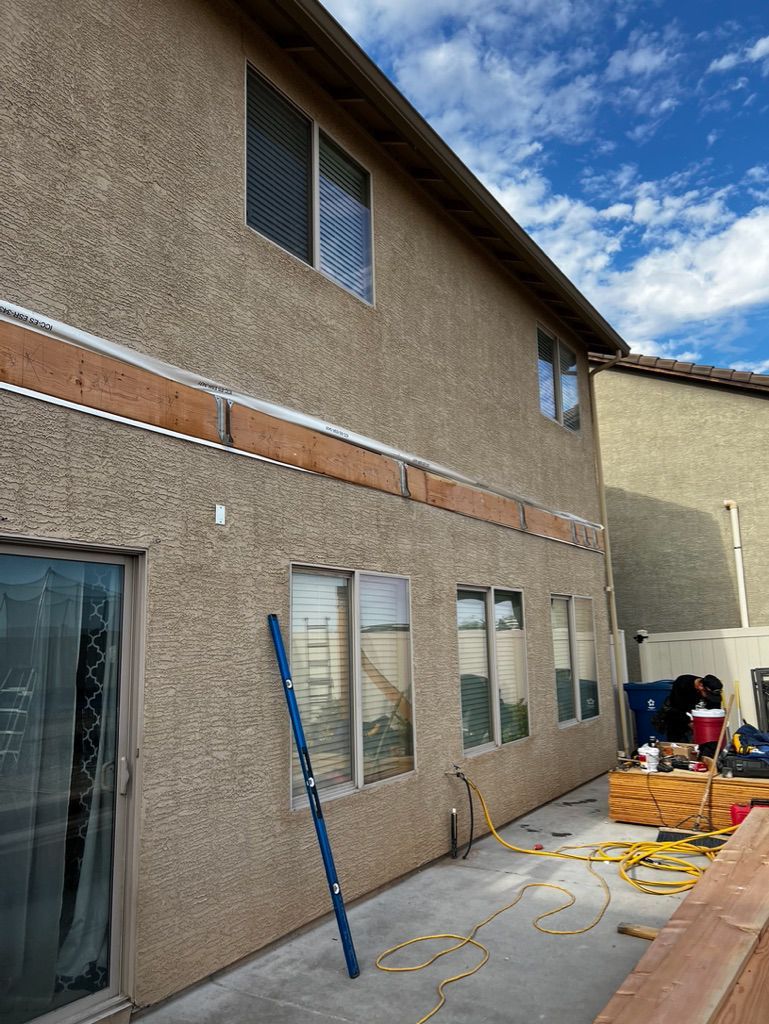 A house with a lot of windows is being remodeled.