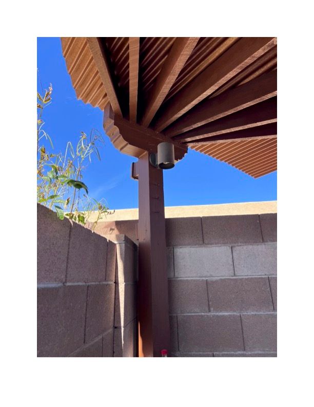 A wooden structure with a blue sky in the background