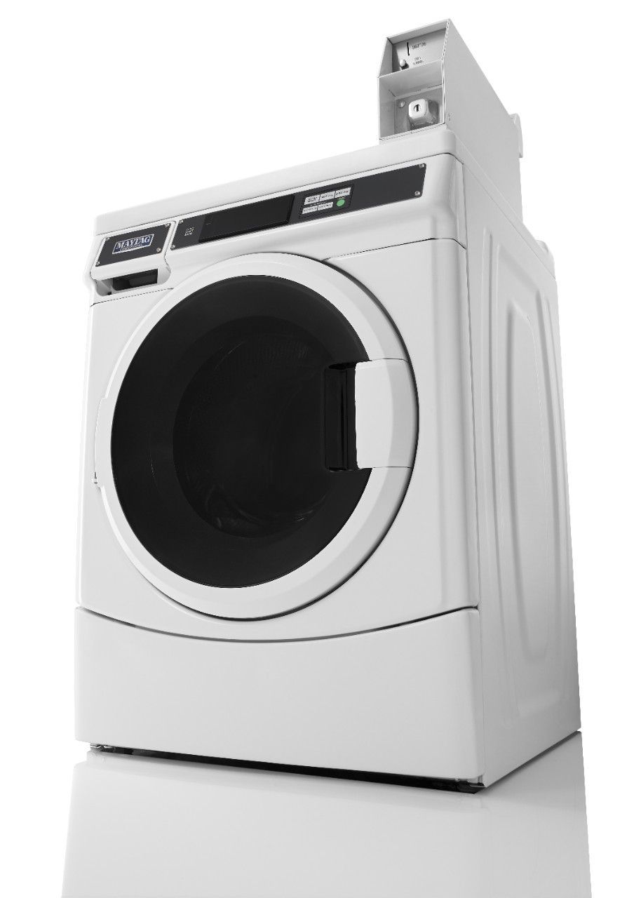 A white washing machine and dryer are sitting on a white surface.