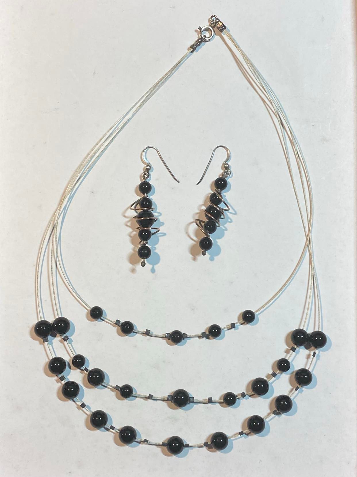 Onyx triple necklace with spiral earrings using Flex-Rite 49 Stirling Silver plated jewellery wire.