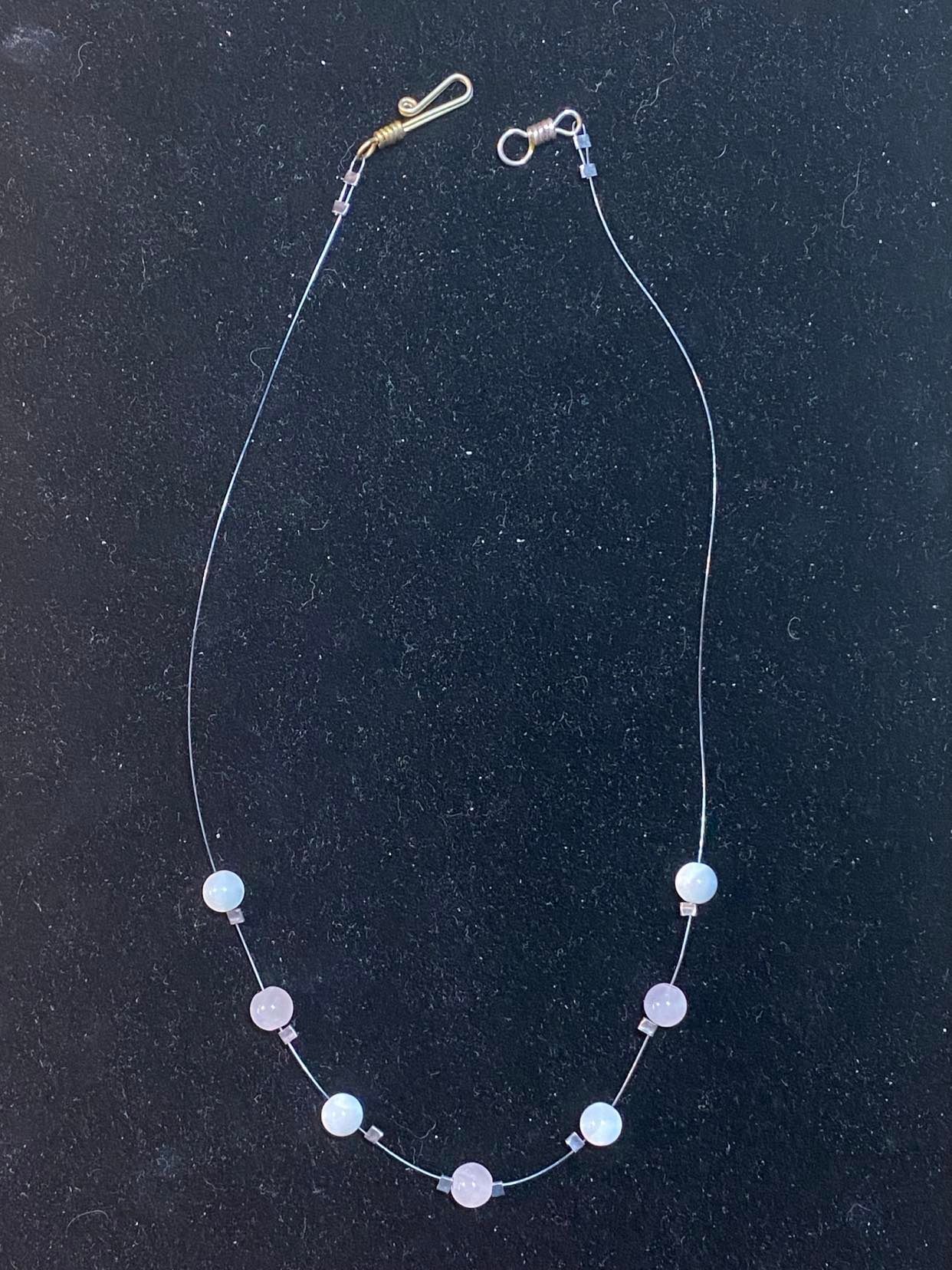 Rose Quartz and Mother of Pearl necklace on illusion cord.