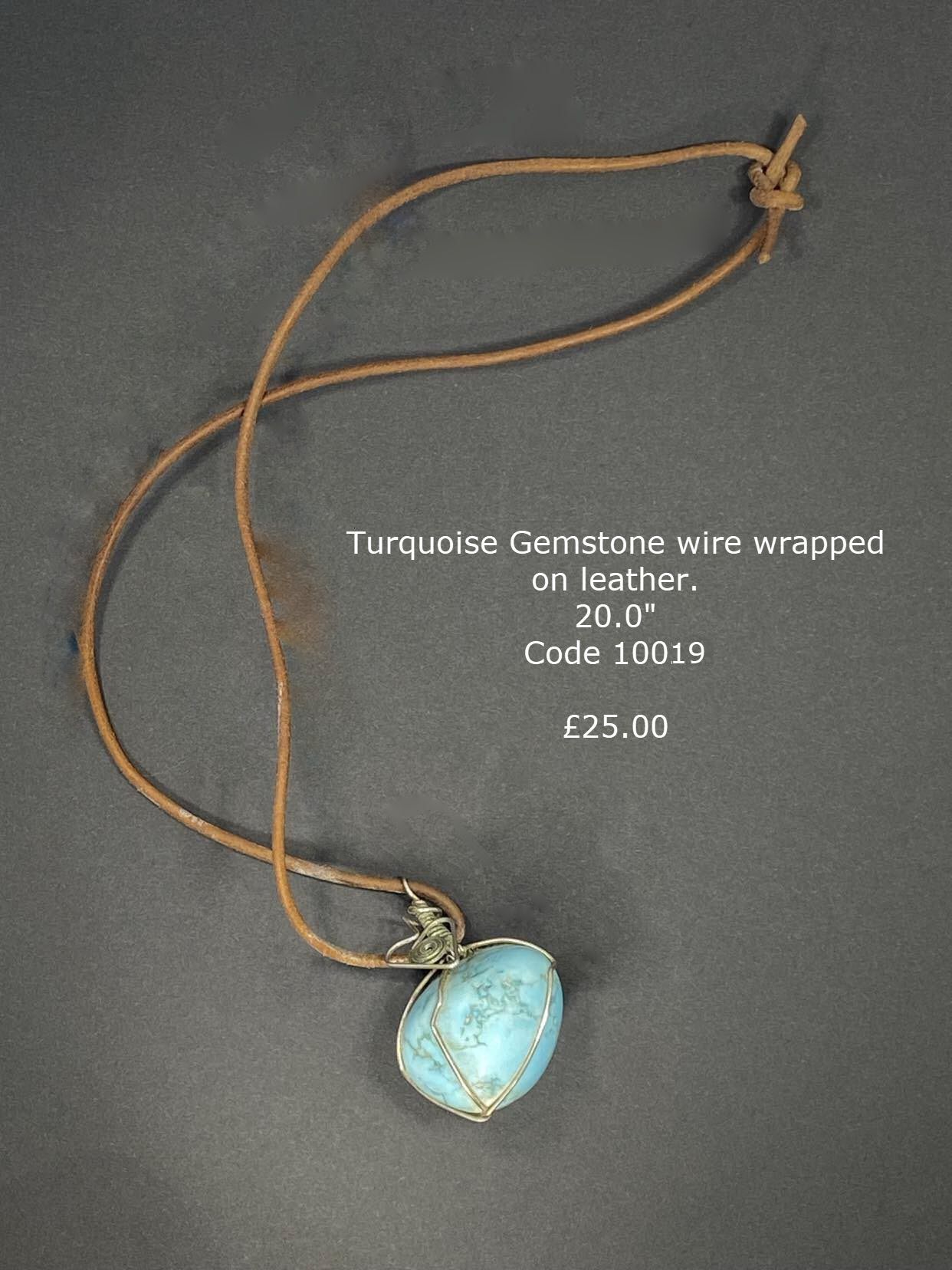 Turquoise tumbled stone on leather, wire wrapped.