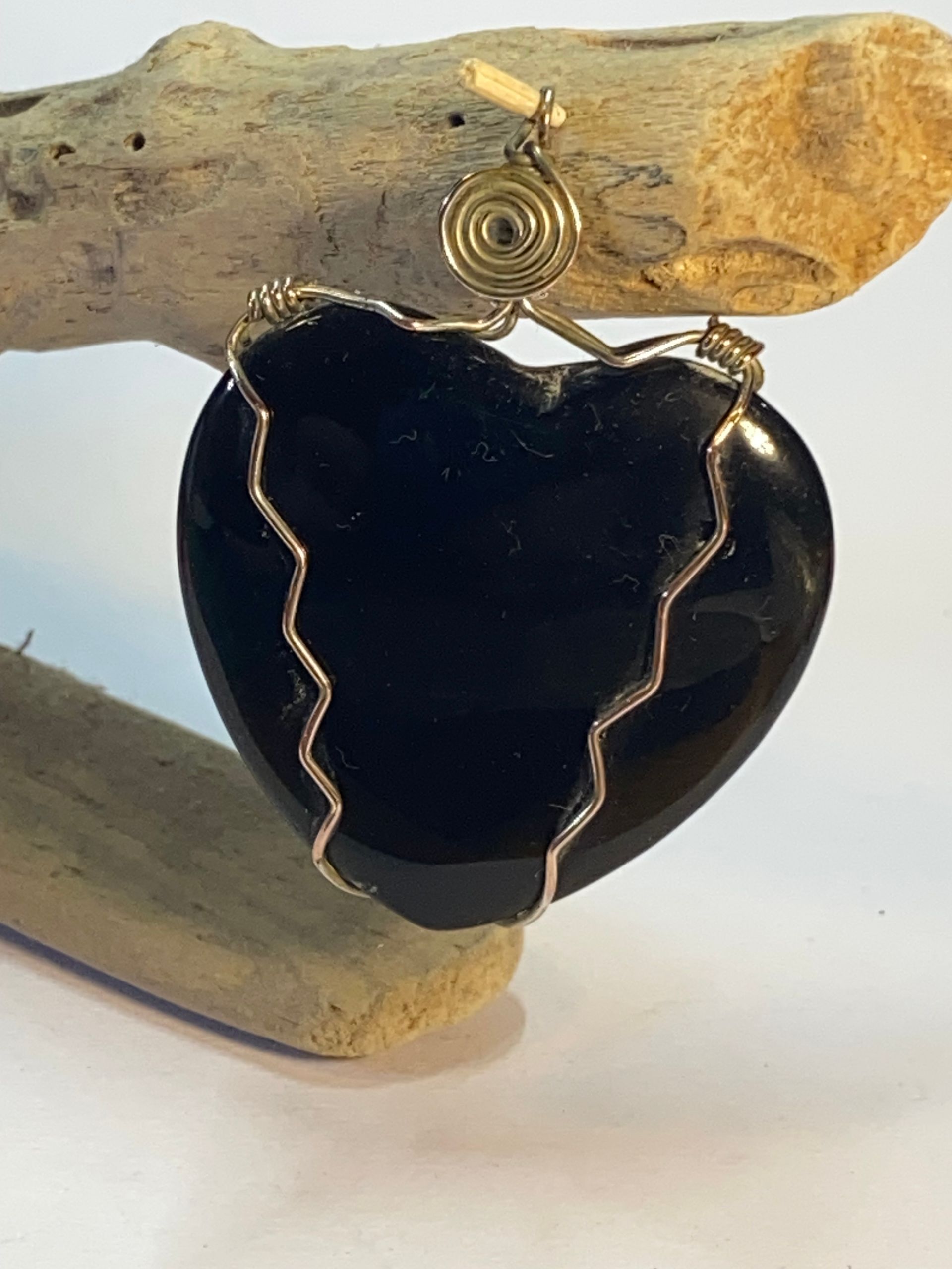 Wire wrapped Heart Black Stone using silver plated copper wire for strength.