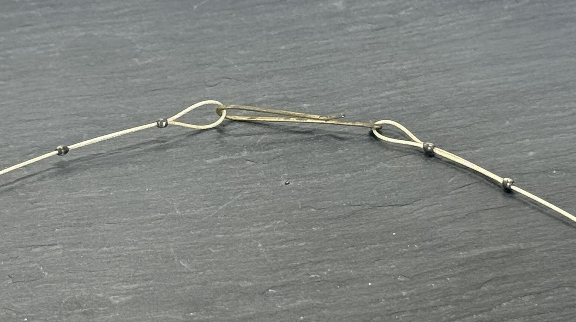Loop made with Sterling Silver crimps with hand made hook with silver coated copper wire.