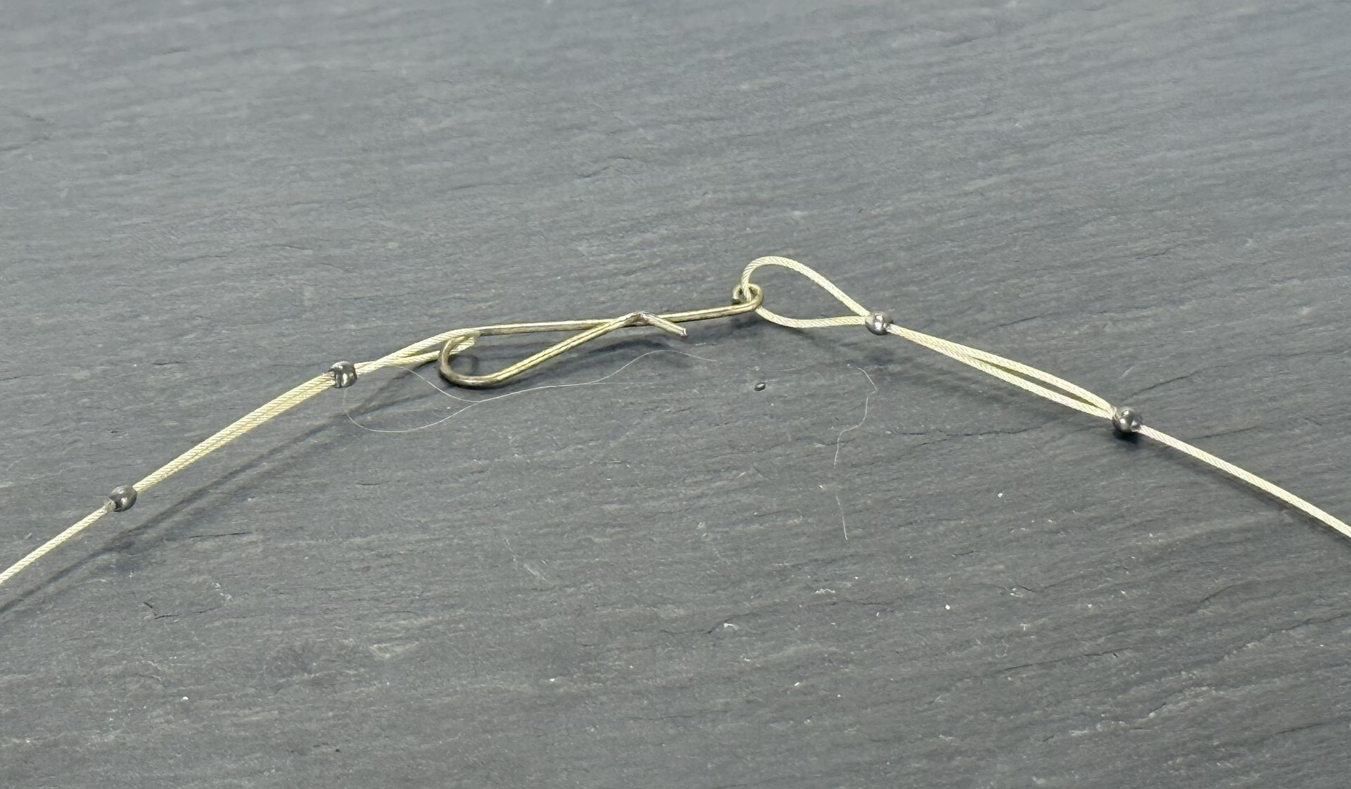 Loop made with Sterling Silver crimps with hand made hook with silver coated copper wire.
