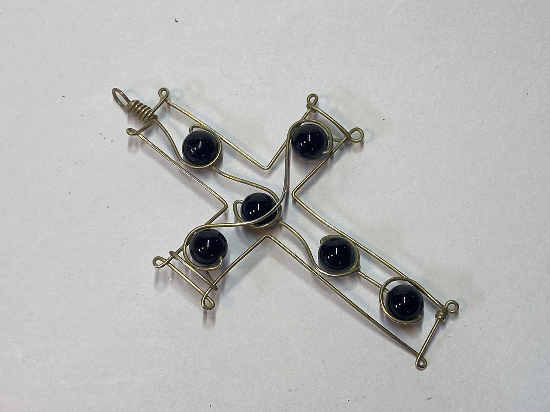 Onyx in a wire cross pendant