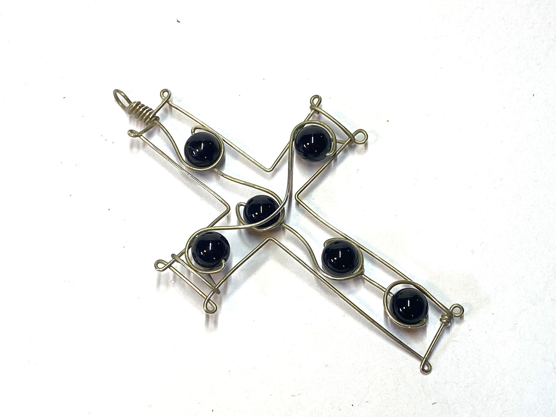 Onyx in a wire cross pendant