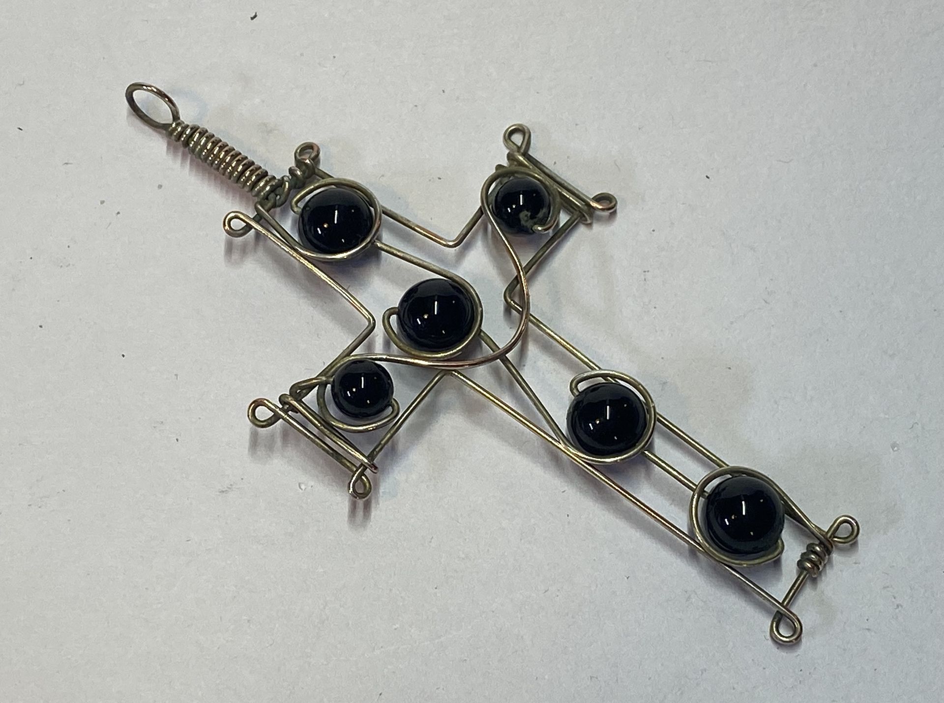 Onyx in a wire cross pendant