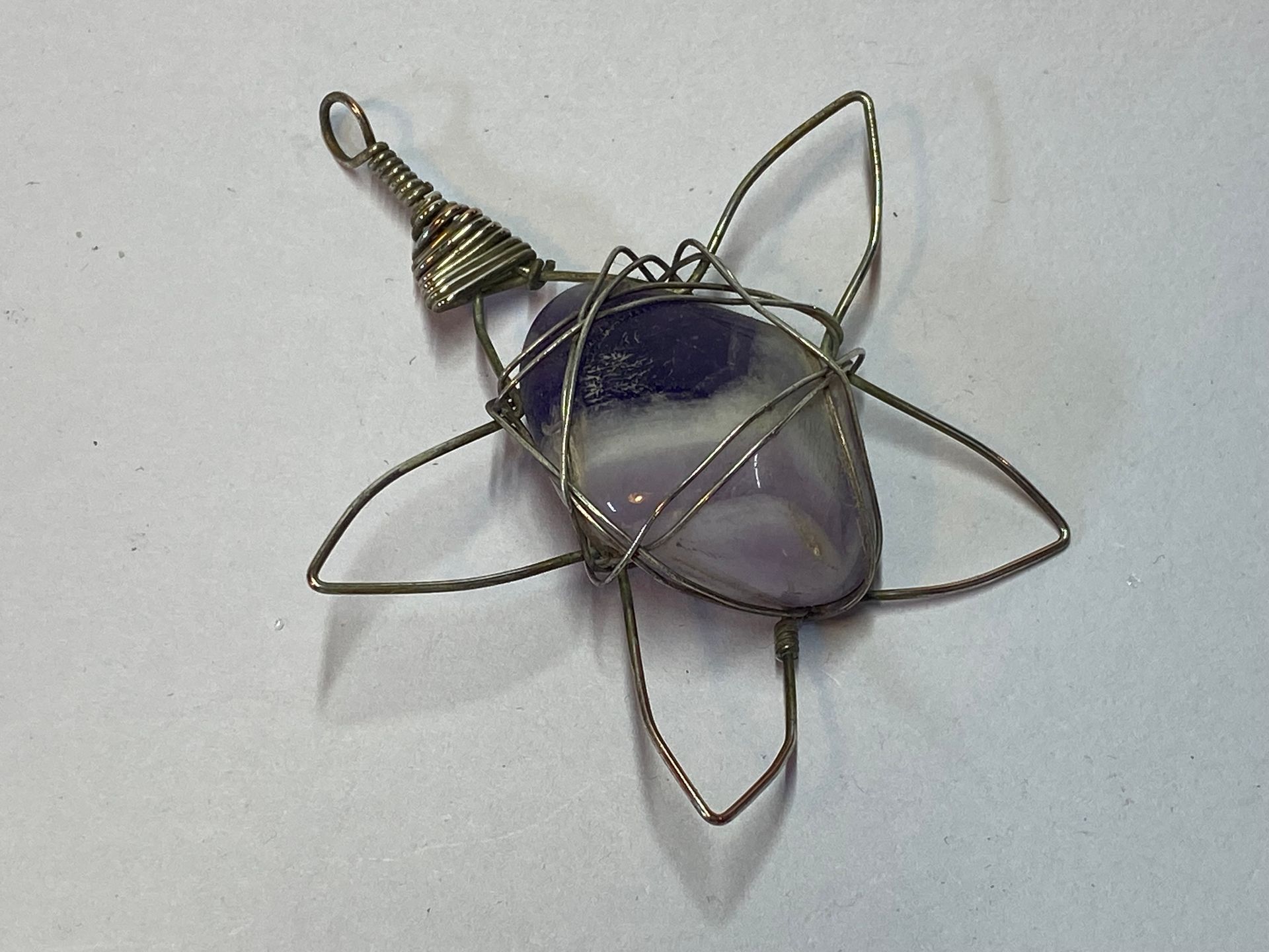 Wire wrapped Amethyst tumbled stone, star shaped.