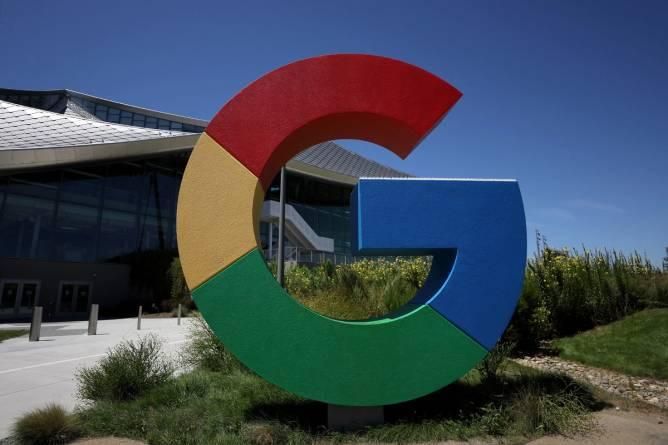 A large google sign is in front of a building