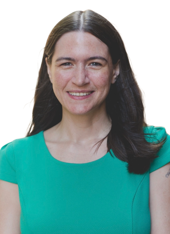 A woman in a green shirt is smiling for the camera