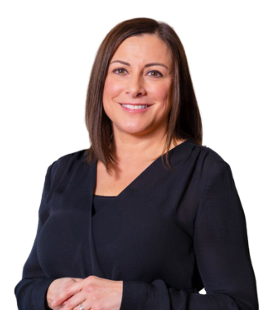 A woman in a blue sweater is smiling for the camera.