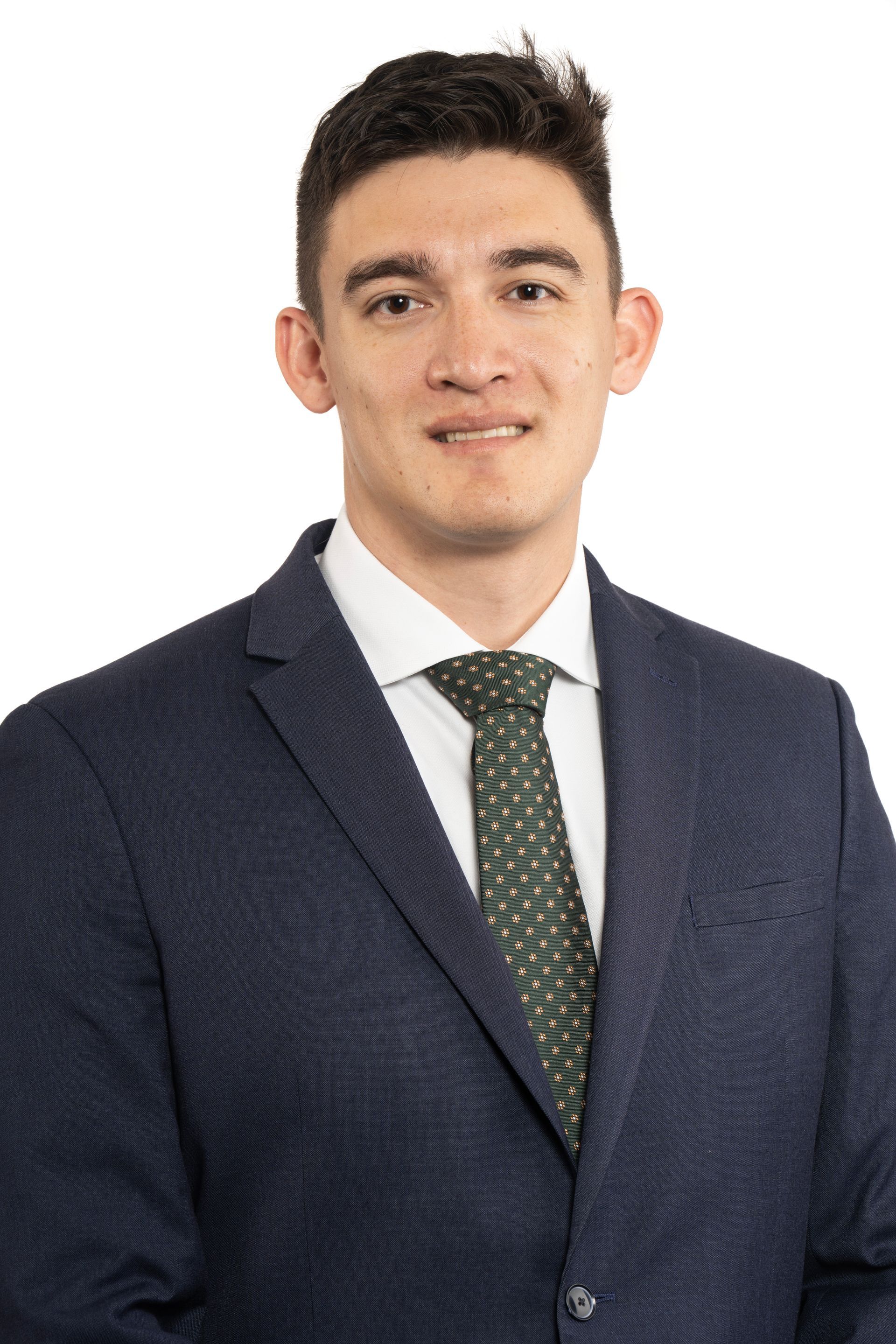 A car is driving down a wet street in the rain.