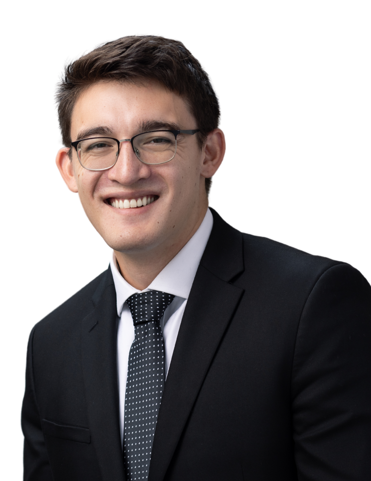 A man in a suit and tie is smiling for the camera.
