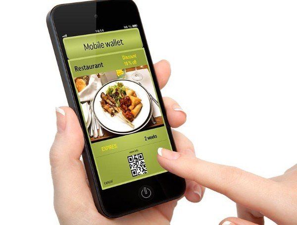 A person is holding a cell phone with a restaurant app on it