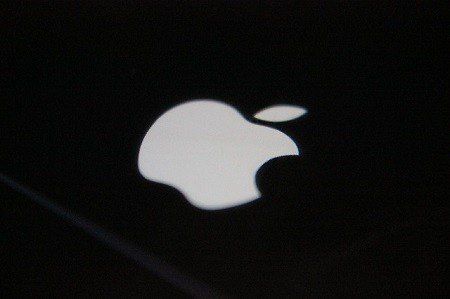 A white apple logo on a black background