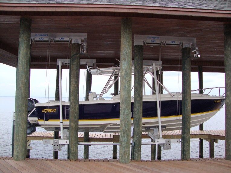 A boat on a lift that has been repaired in surf city nc