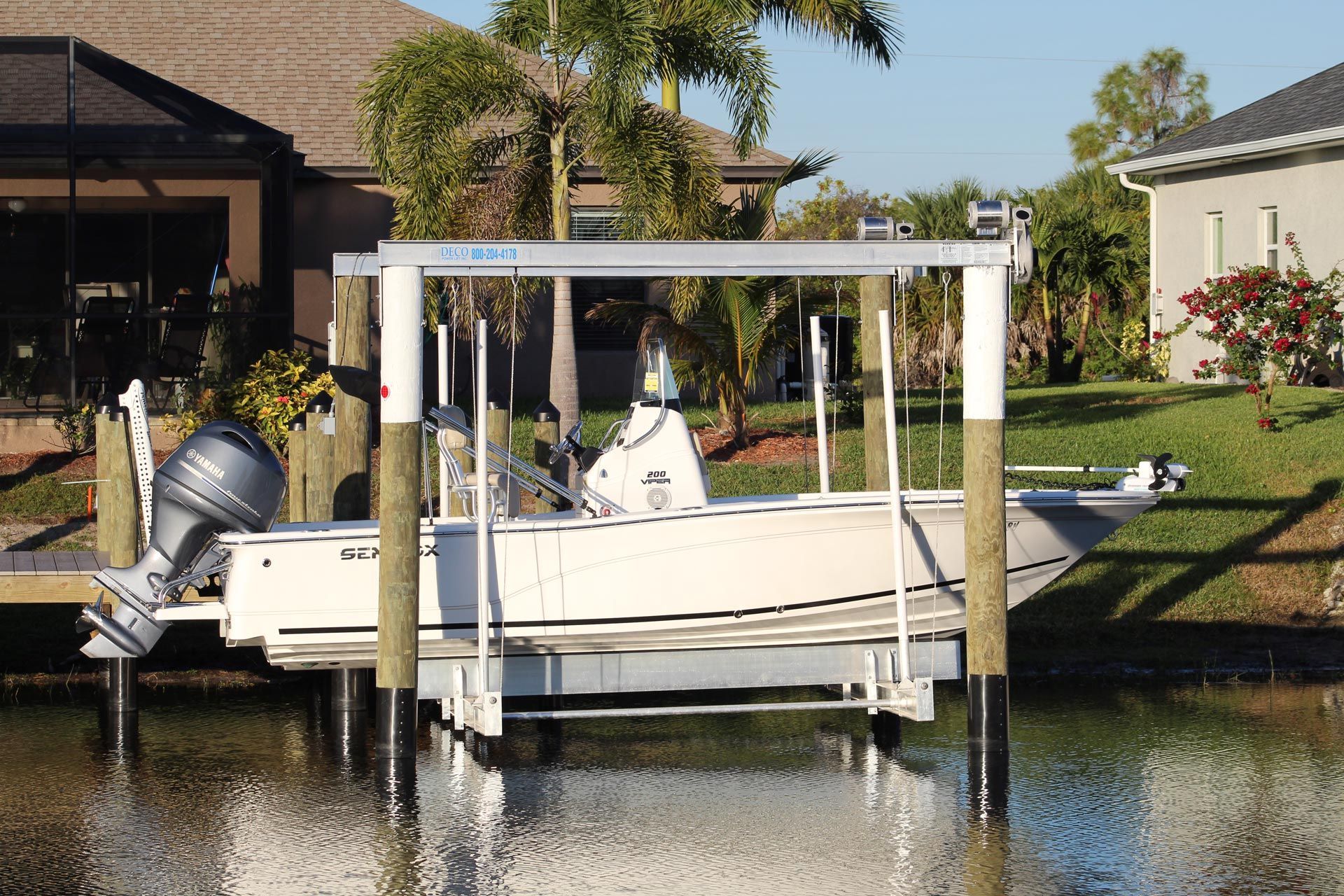 A boat is docked at a dock in front of a house in surf city nc