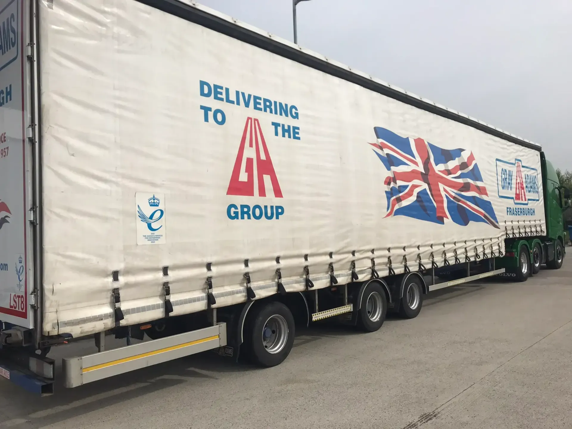 A semi-truck trailer with the Union Jack flag and