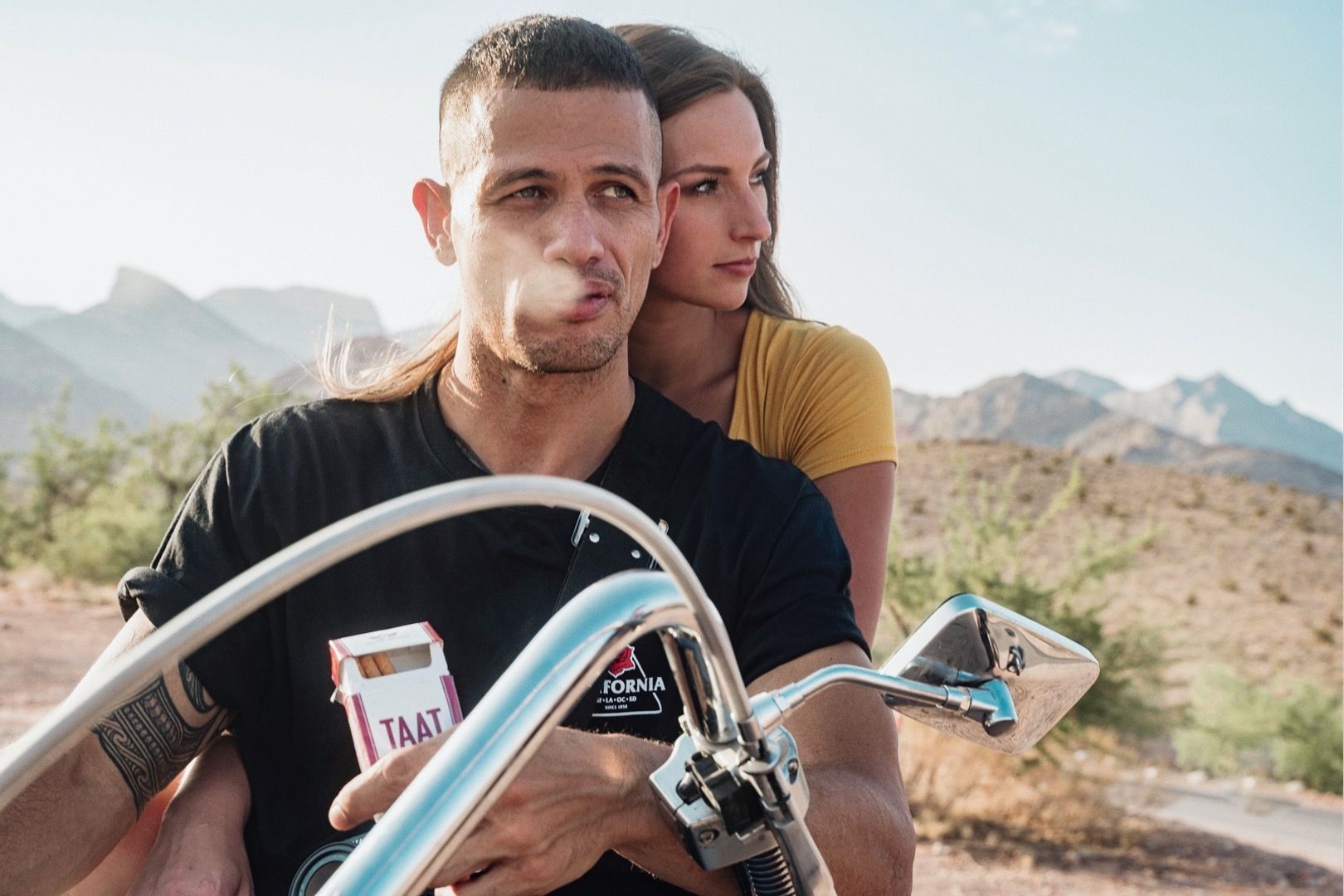 Las Vegas models pose on motorcycle for commercial shoot at Red Rock Canyon.