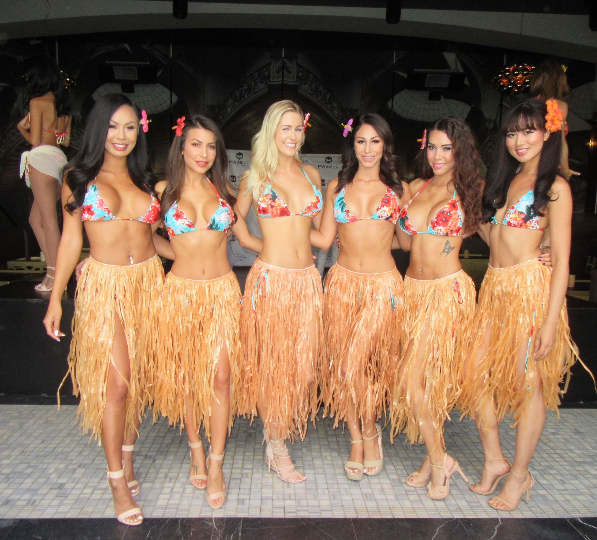 Dancers in tropical bikinis for Fantasy Island themed corporate event for Mass Torts Conference at the Bellagio Las Vegas.