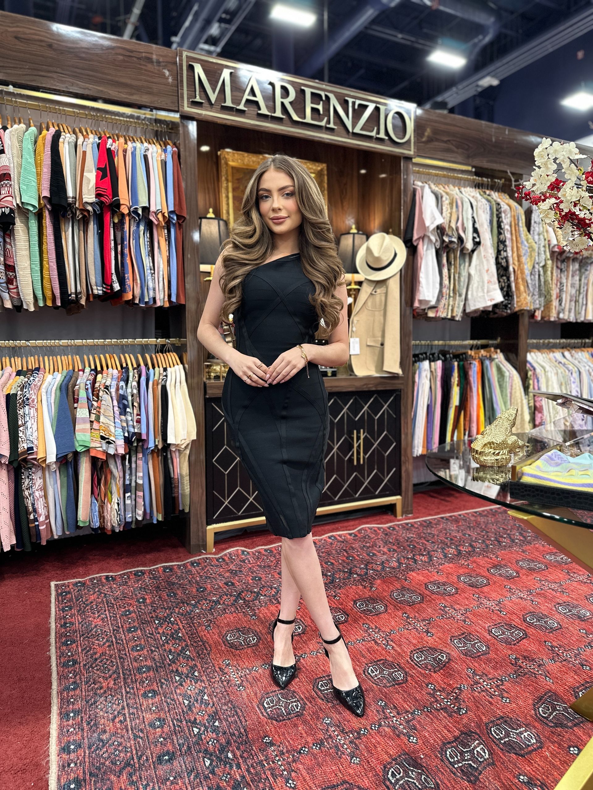 Las Vegas promo model hosting trade show booth at fashion conference.