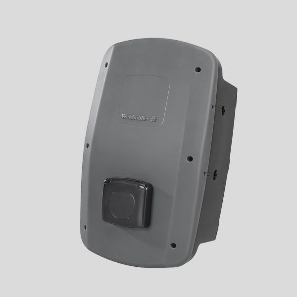 A gray box with a black button on the side