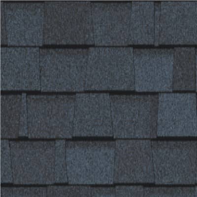 A close up of a row of black shingles on a roof.