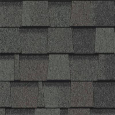 A close up of a roof with a lot of shingles on it.